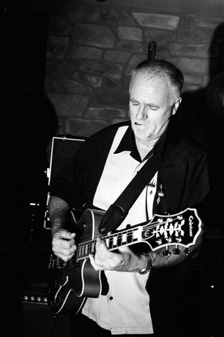 TJ
                                Cadman - Blues guitarist on stage